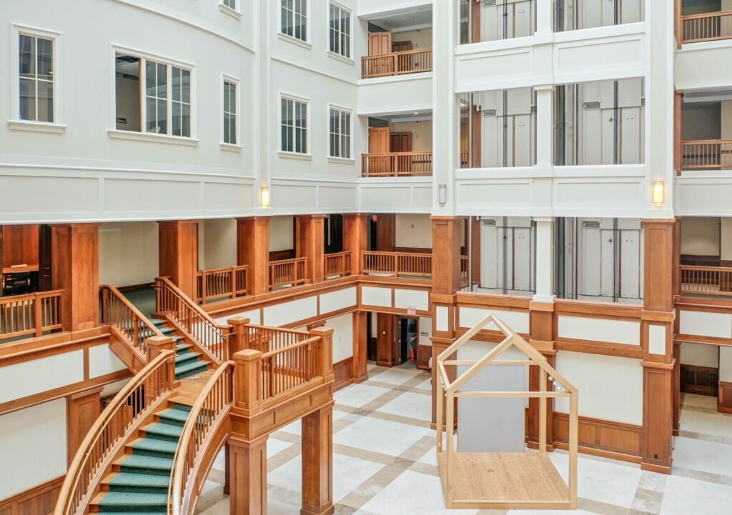 A seven-storey office building shaped like a giant picnic basket is back on the market for $8.5m - complete with 75-ton handles fitted with heating elements to stop ice building up.