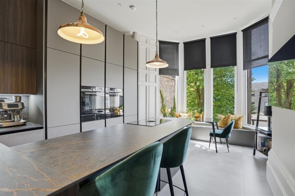 A Victorian flat on the market for £500,000 in Scotland comes with a rather unusual feature - a downstairs loo that appears to double as a fully stocked wine cellar.