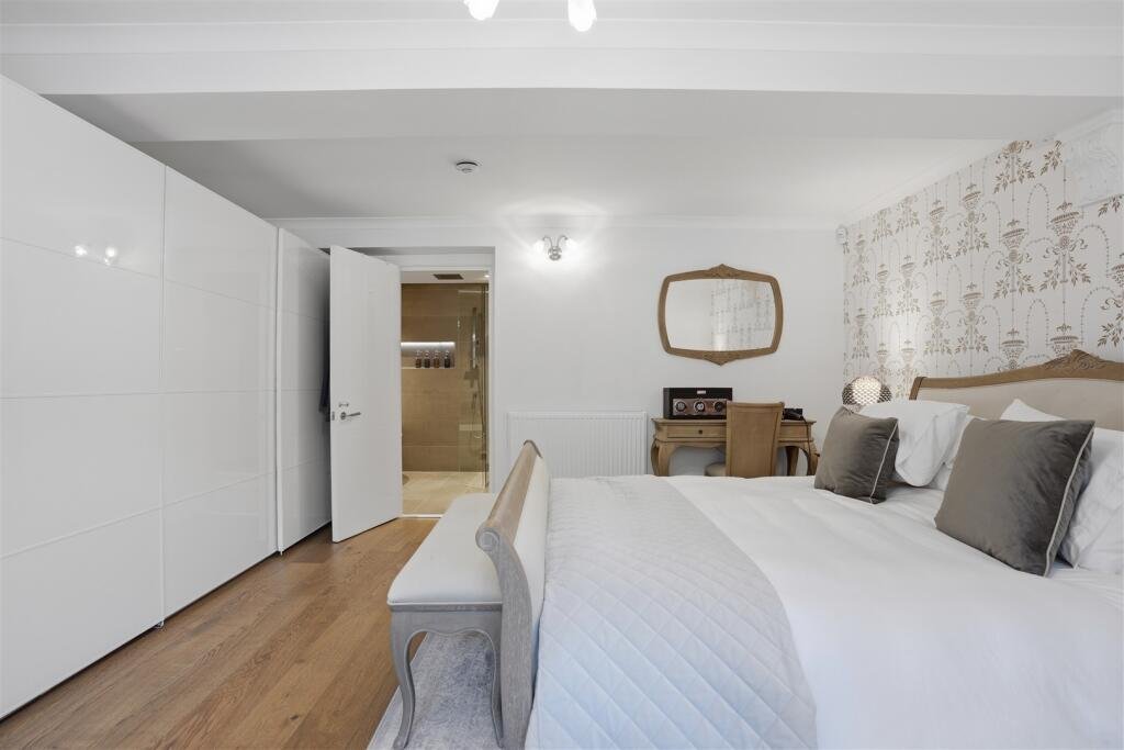 A Victorian flat on the market for £500,000 in Scotland comes with a rather unusual feature - a downstairs loo that appears to double as a fully stocked wine cellar.