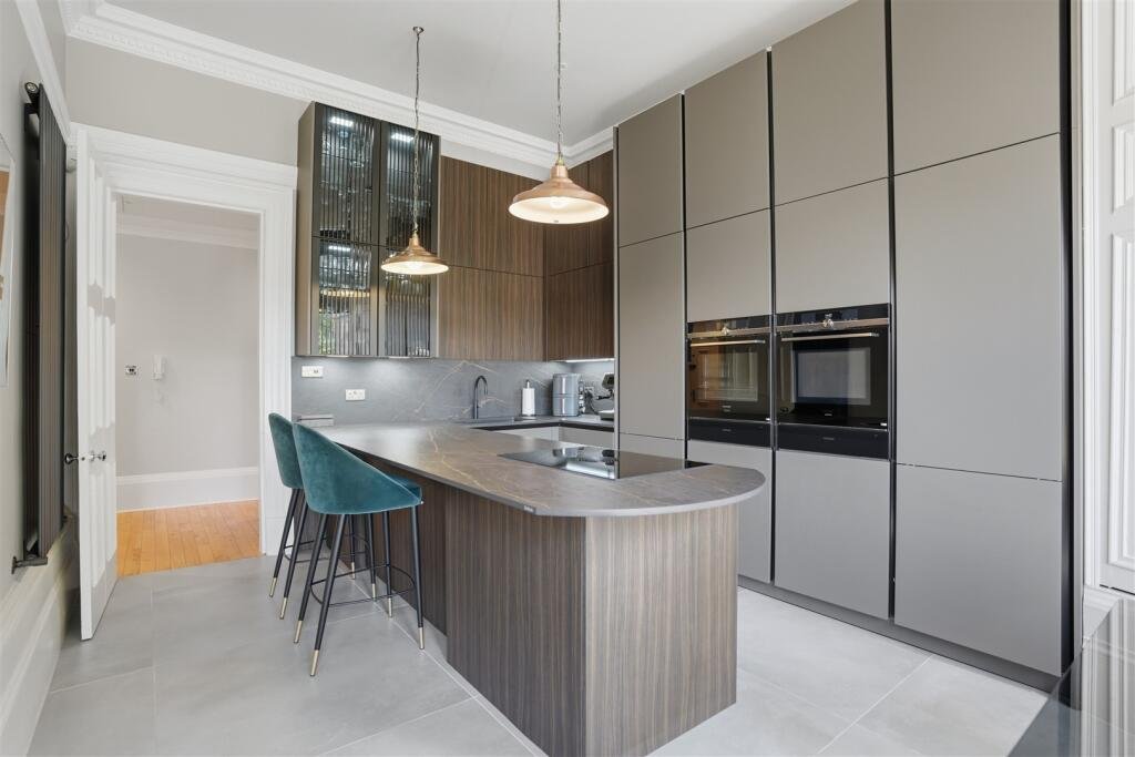 A Victorian flat on the market for £500,000 in Scotland comes with a rather unusual feature - a downstairs loo that appears to double as a fully stocked wine cellar.