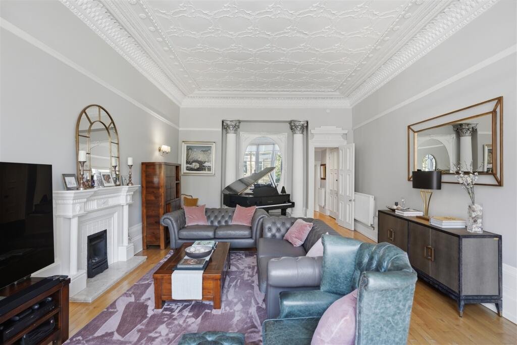 A Victorian flat on the market for £500,000 in Scotland comes with a rather unusual feature - a downstairs loo that appears to double as a fully stocked wine cellar.