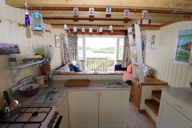 Tiny beach huts are still commanding eye-watering prices - with one in Christchurch, Dorset, on the market for a staggering £425,000 despite falling demand.