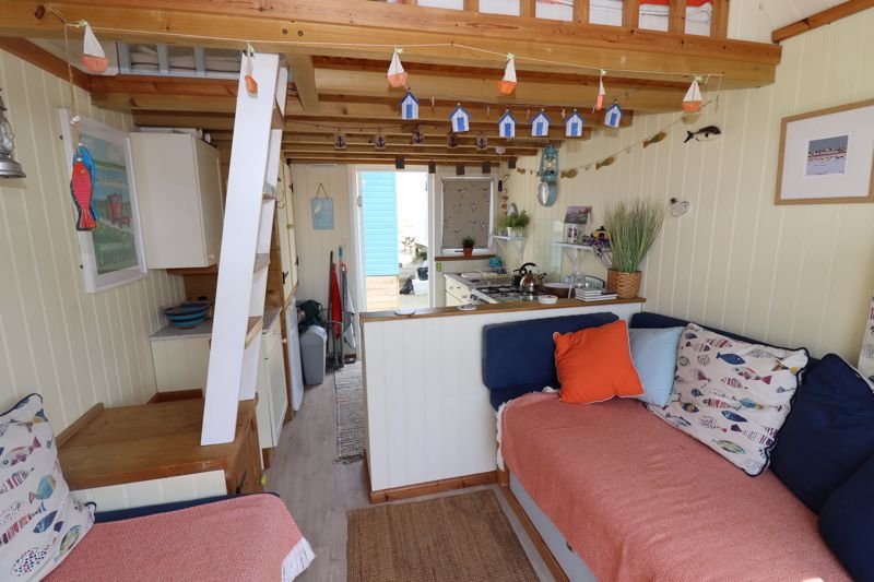 Tiny beach huts are still commanding eye-watering prices - with one in Christchurch, Dorset, on the market for a staggering £425,000 despite falling demand.