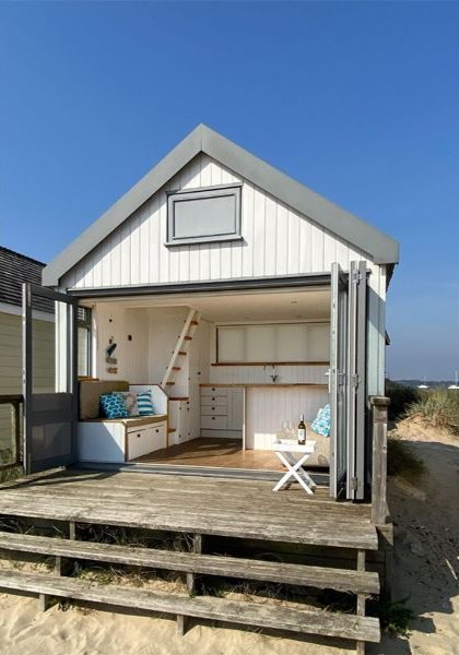Tiny beach huts are still commanding eye-watering prices - with one in Christchurch, Dorset, on the market for a staggering £425,000 despite falling demand.