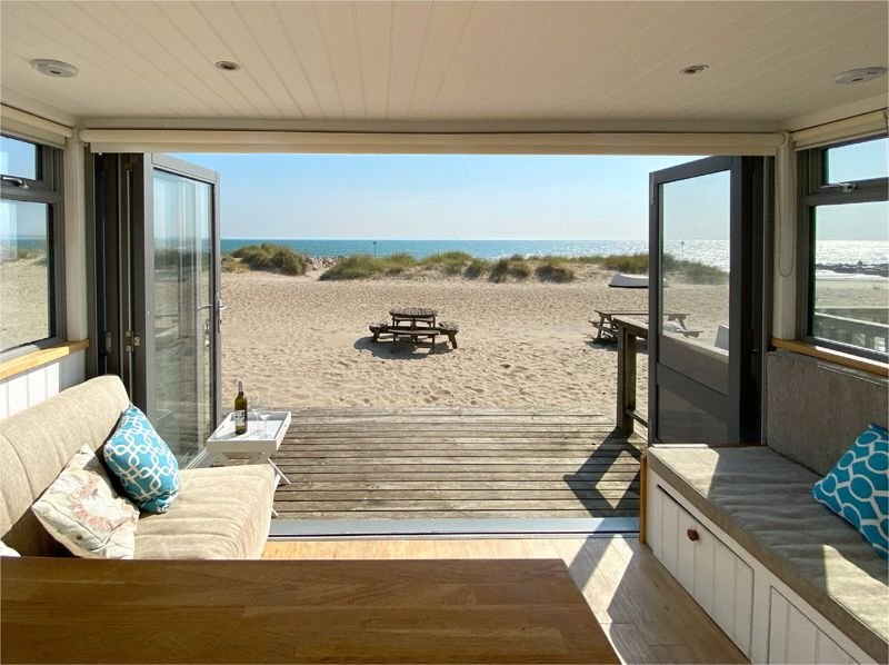Tiny beach huts are still commanding eye-watering prices - with one in Christchurch, Dorset, on the market for a staggering £425,000 despite falling demand.