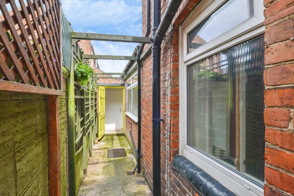 A three-bed home has gone on sale for £110,000 with an "un-loo-sual" twist - a toilet hidden in the kitchen, just feet from the cooker, fridge and sink.