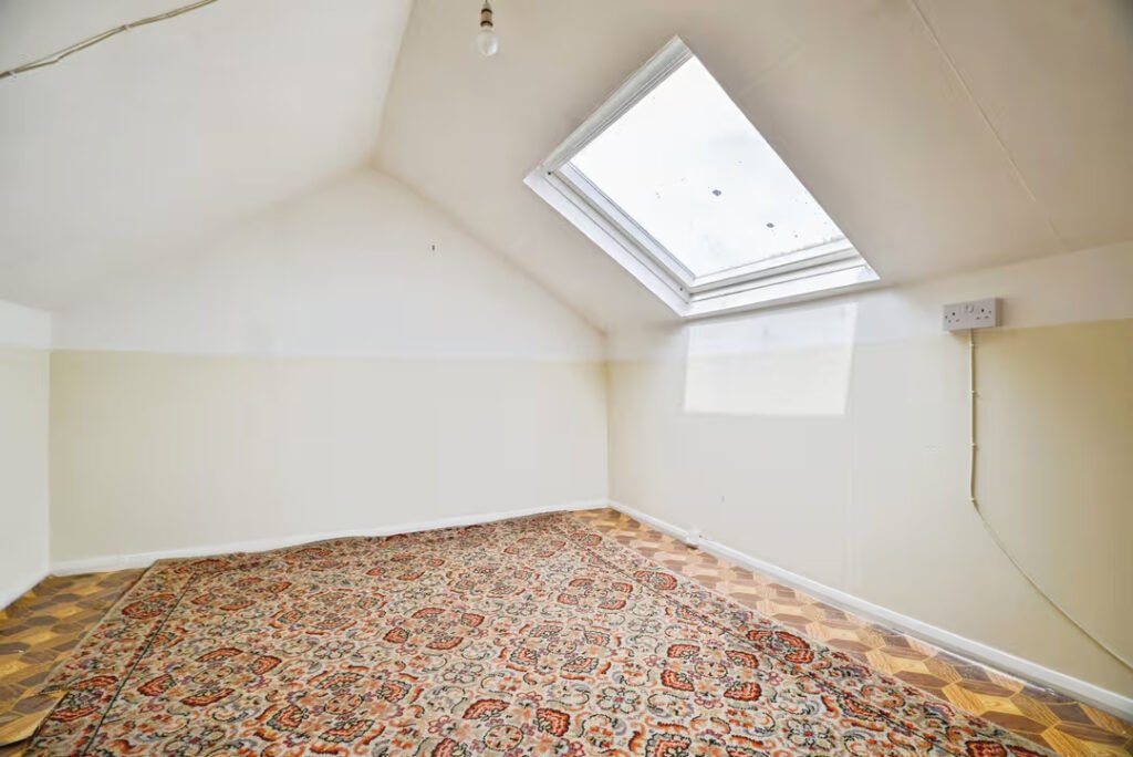 A three-bed home has gone on sale for £110,000 with an "un-loo-sual" twist - a toilet hidden in the kitchen, just feet from the cooker, fridge and sink.