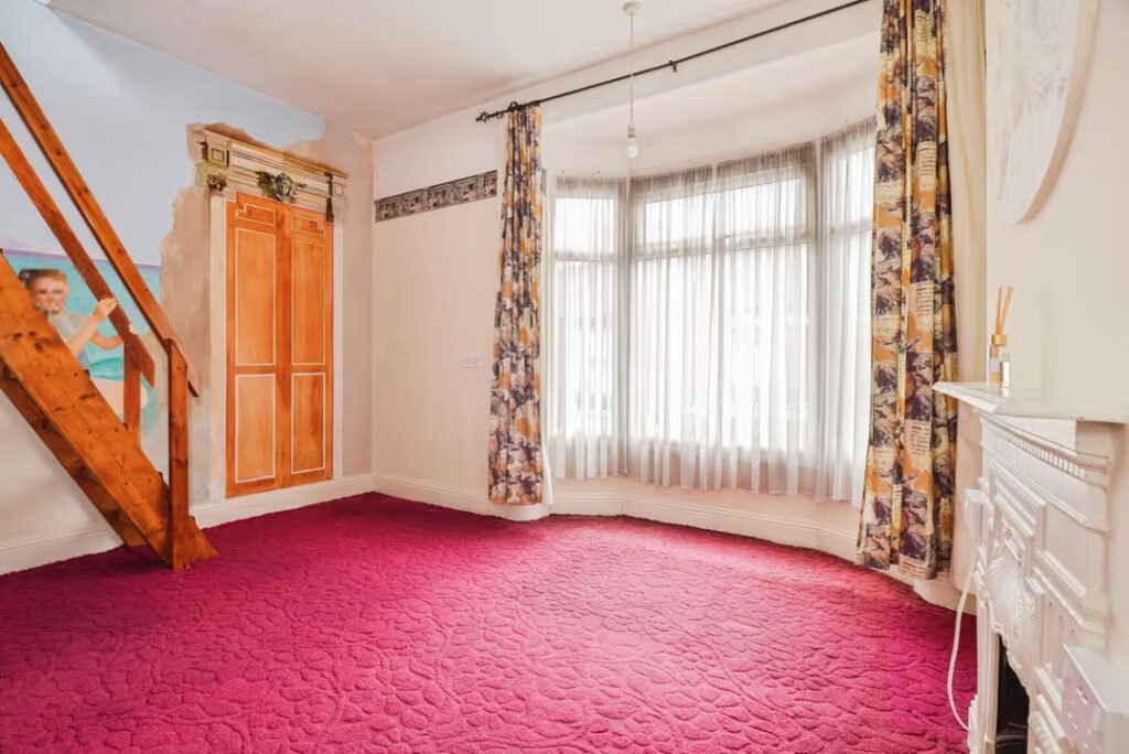 A three-bed home has gone on sale for £110,000 with an "un-loo-sual" twist - a toilet hidden in the kitchen, just feet from the cooker, fridge and sink.