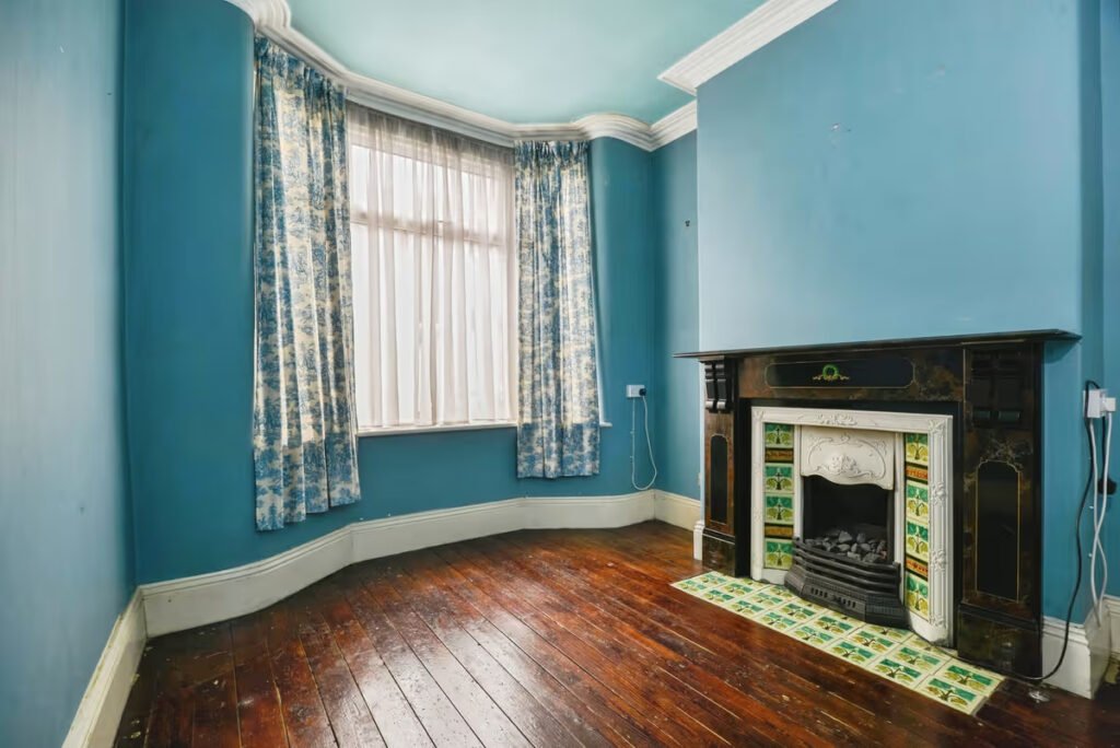 A three-bed home has gone on sale for £110,000 with an "un-loo-sual" twist - a toilet hidden in the kitchen, just feet from the cooker, fridge and sink.