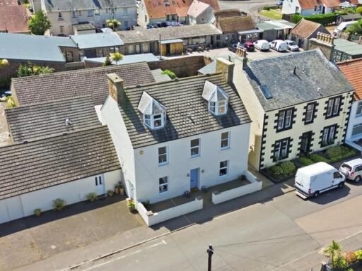 An ordinary-looking house on sale for £600,000 hides a huge ballroom with a dance floor, stage and starry ceiling - plus a stone wishing well in the dining room.