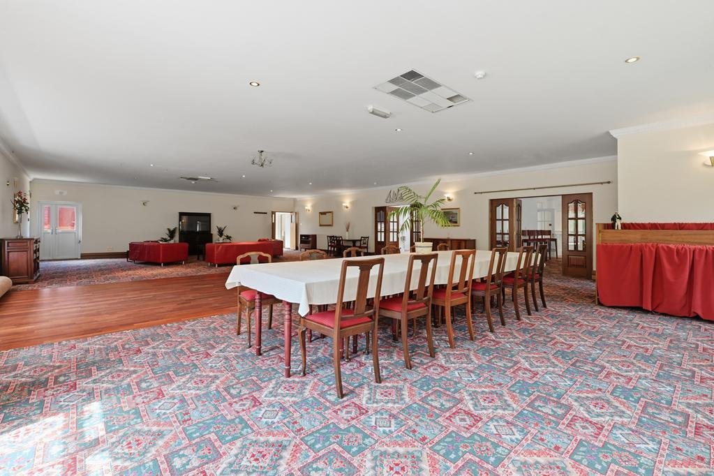 An ordinary-looking house on sale for £600,000 hides a huge ballroom with a dance floor, stage and starry ceiling - plus a stone wishing well in the dining room.
