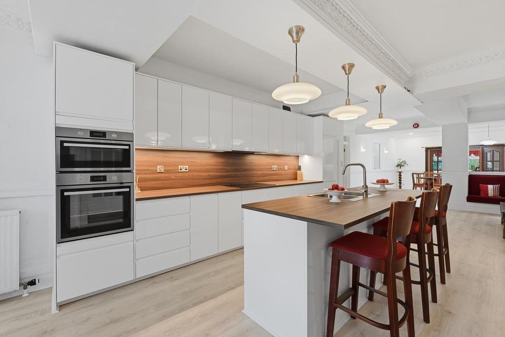 An ordinary-looking house on sale for £600,000 hides a huge ballroom with a dance floor, stage and starry ceiling - plus a stone wishing well in the dining room.