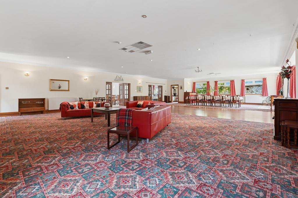 An ordinary-looking house on sale for £600,000 hides a huge ballroom with a dance floor, stage and starry ceiling - plus a stone wishing well in the dining room.