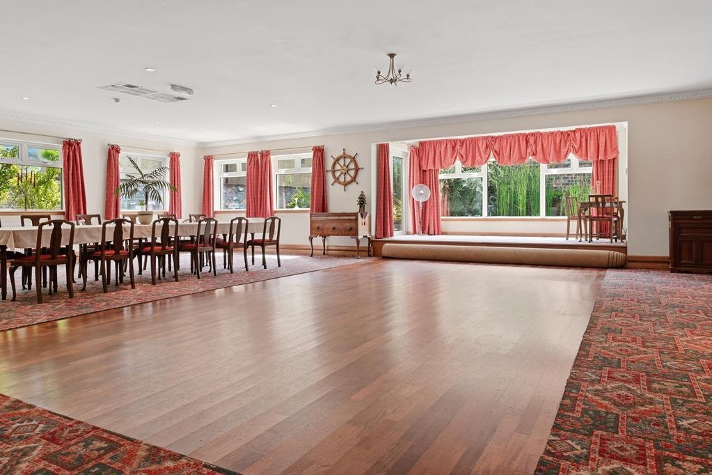 An ordinary-looking house on sale for £600,000 hides a huge ballroom with a dance floor, stage and starry ceiling - plus a stone wishing well in the dining room.