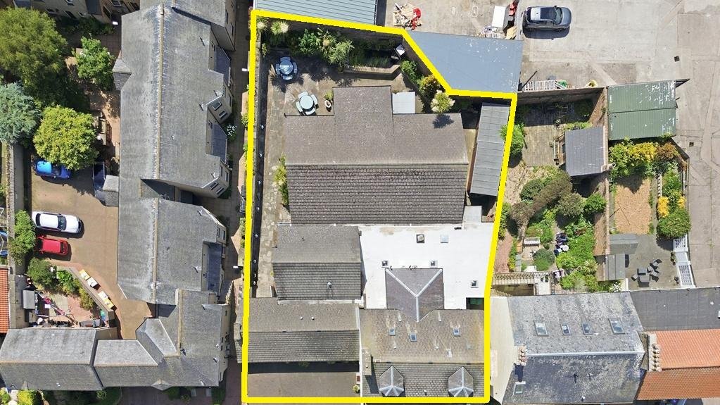 An ordinary-looking house on sale for £600,000 hides a huge ballroom with a dance floor, stage and starry ceiling - plus a stone wishing well in the dining room.