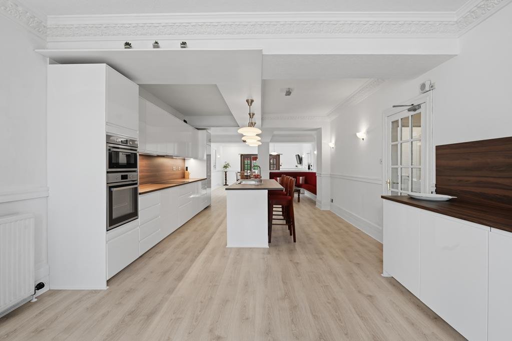 An ordinary-looking house on sale for £600,000 hides a huge ballroom with a dance floor, stage and starry ceiling - plus a stone wishing well in the dining room.