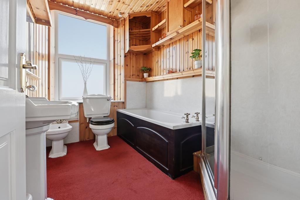 An ordinary-looking house on sale for £600,000 hides a huge ballroom with a dance floor, stage and starry ceiling - plus a stone wishing well in the dining room.