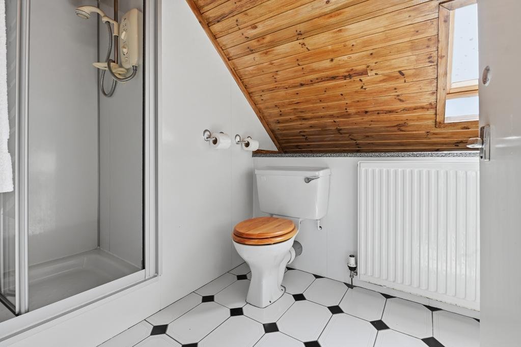 An ordinary-looking house on sale for £600,000 hides a huge ballroom with a dance floor, stage and starry ceiling - plus a stone wishing well in the dining room.