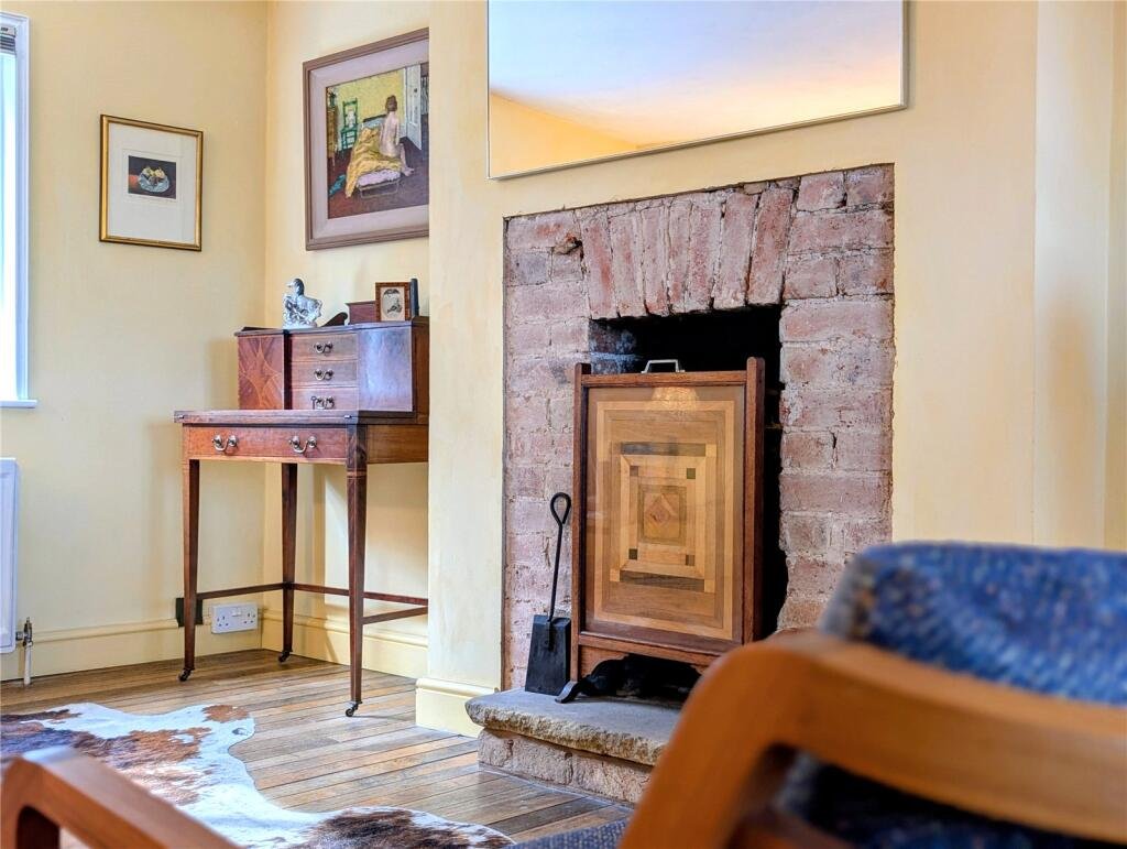 A quaint £220,000 cottage has gone on the market - but its bathroom arrangement, with the loo and bath behind see-through glass, may leave buyers feeling flushed.