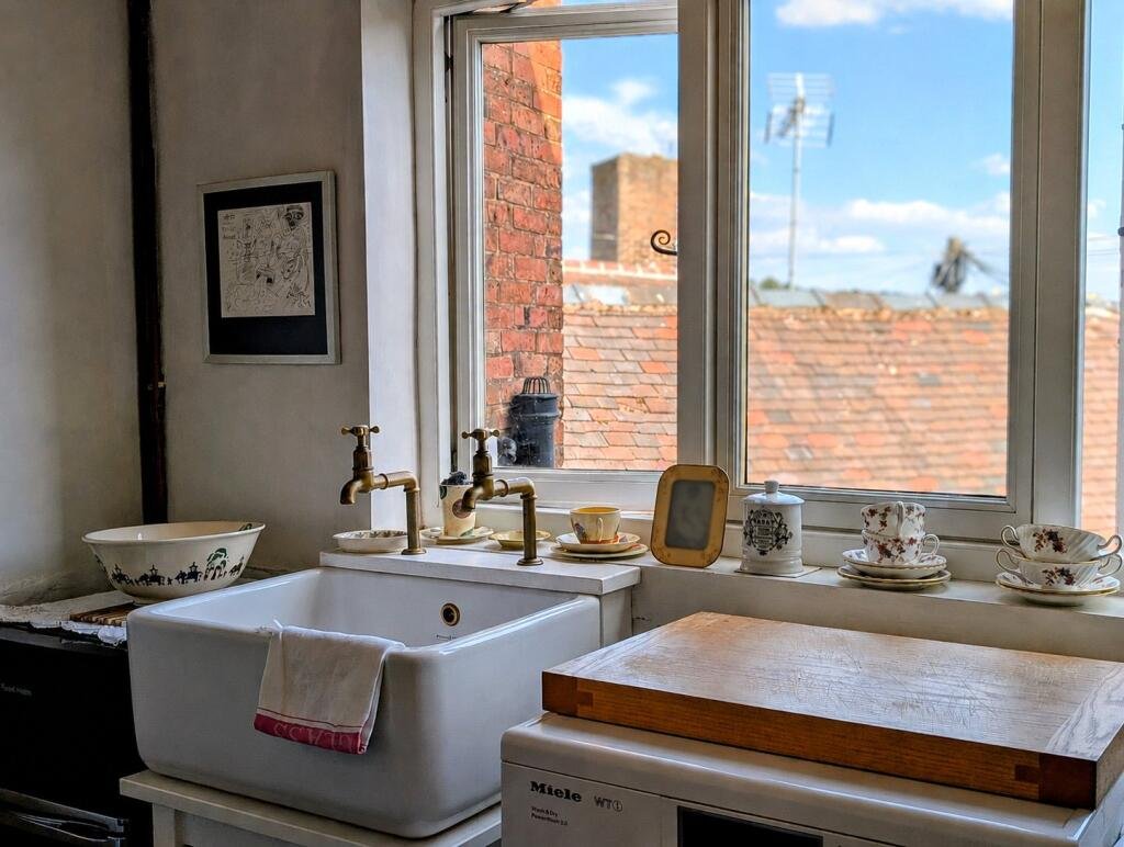 A quaint £220,000 cottage has gone on the market - but its bathroom arrangement, with the loo and bath behind see-through glass, may leave buyers feeling flushed.