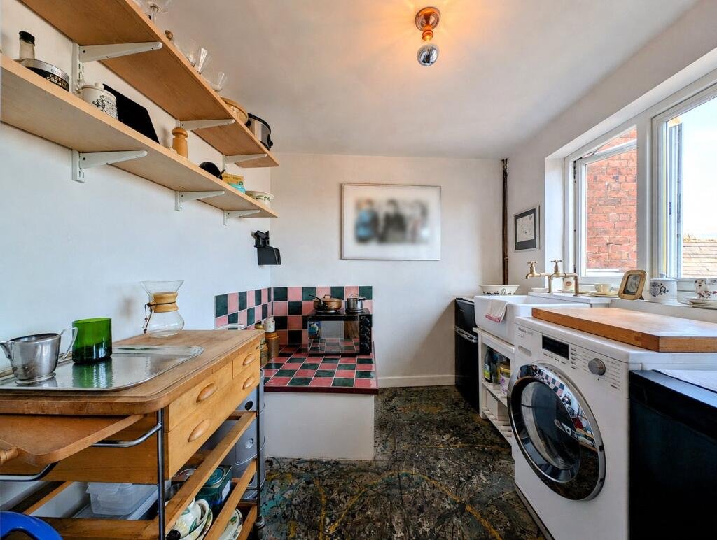 A quaint £220,000 cottage has gone on the market - but its bathroom arrangement, with the loo and bath behind see-through glass, may leave buyers feeling flushed.