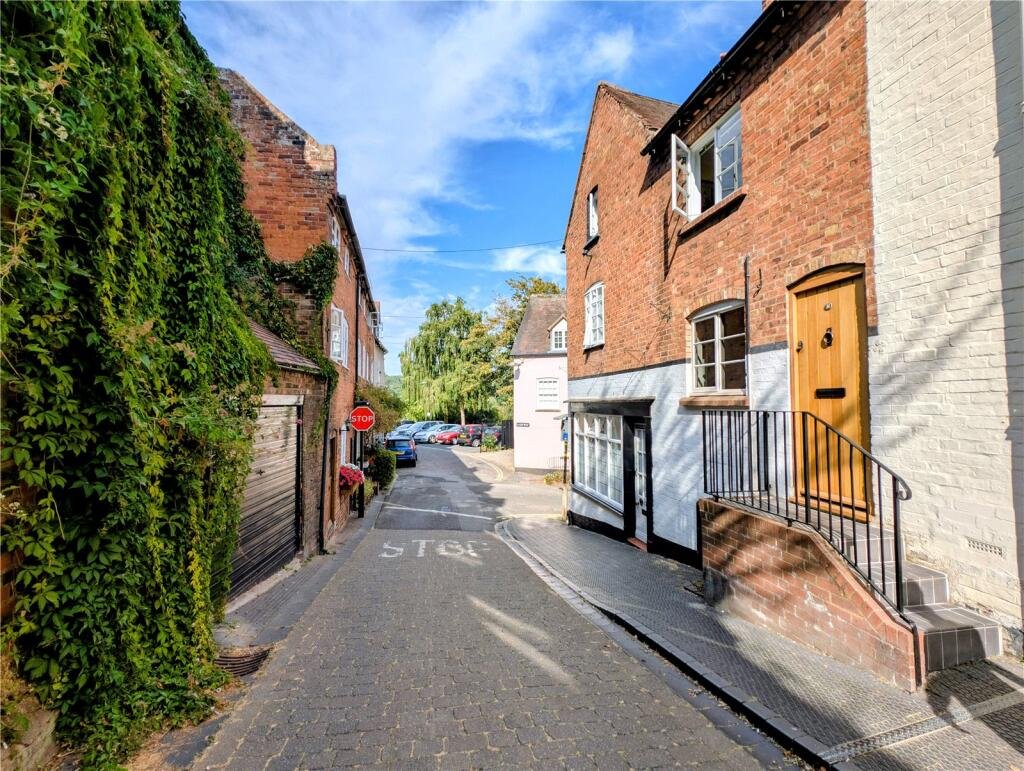 A quaint £220,000 cottage has gone on the market - but its bathroom arrangement, with the loo and bath behind see-through glass, may leave buyers feeling flushed.