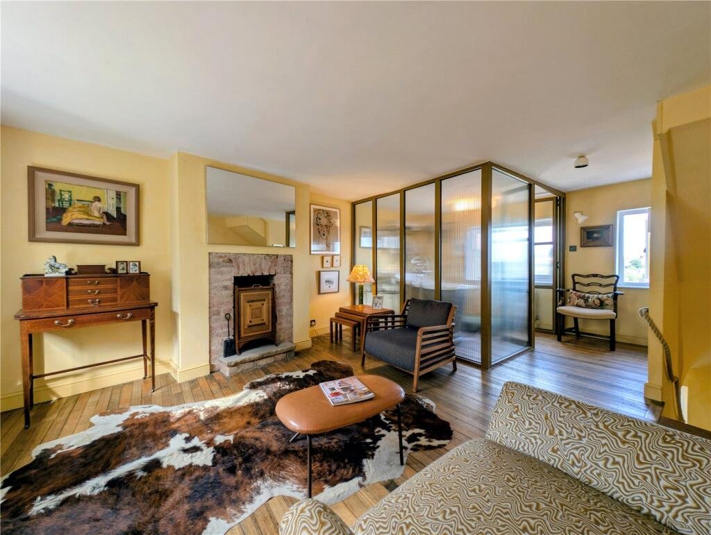 A quaint £220,000 cottage has gone on the market - but its bathroom arrangement, with the loo and bath behind see-through glass, may leave buyers feeling flushed.