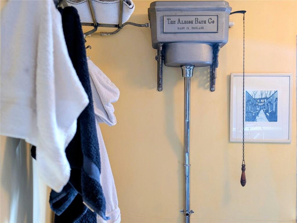A quaint £220,000 cottage has gone on the market - but its bathroom arrangement, with the loo and bath behind see-through glass, may leave buyers feeling flushed.
