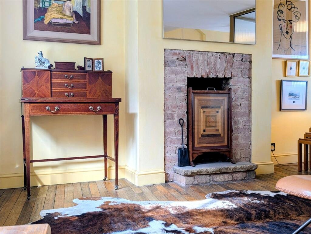 A quaint £220,000 cottage has gone on the market - but its bathroom arrangement, with the loo and bath behind see-through glass, may leave buyers feeling flushed.