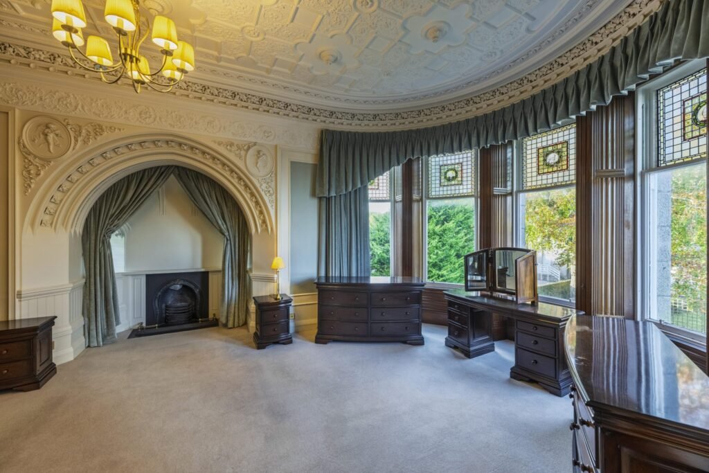 A magnificent eight-bedroom castle boasting a secret door, turret bedroom and 20 stunning stained-glass windows has gone on the market for £1.5million.