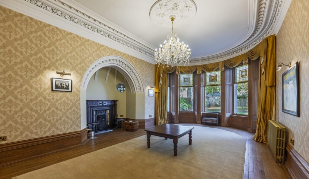 A magnificent eight-bedroom castle boasting a secret door, turret bedroom and 20 stunning stained-glass windows has gone on the market for £1.5million.