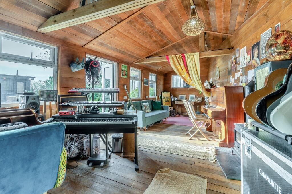 Charlotte Church's historic Welsh cottage has hit the market for £695,000 - complete with a secret music studio hidden away in its jungle-like exotic garden.