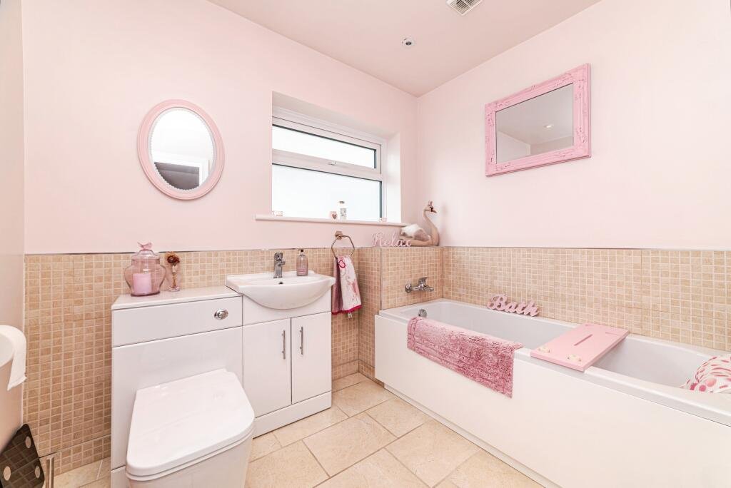 Britain's own Barbie Dream House is on sale for £725,000 - with a bubblegum kitchen, pink staircase, pink SMEG fridge and even a pink garage door.