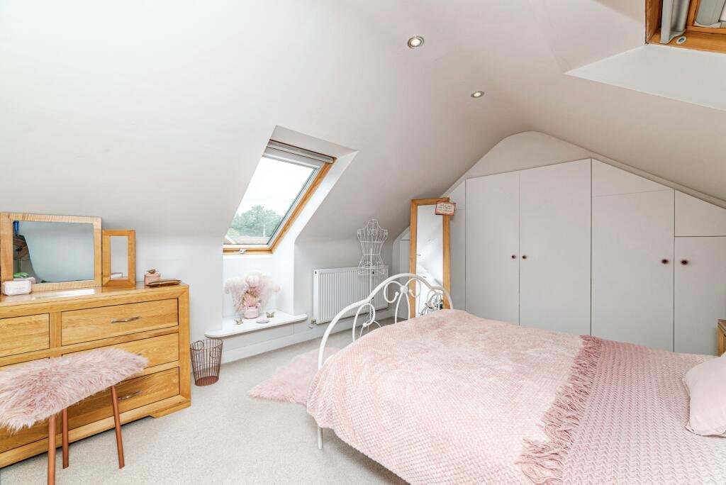 Britain's own Barbie Dream House is on sale for £725,000 - with a bubblegum kitchen, pink staircase, pink SMEG fridge and even a pink garage door.