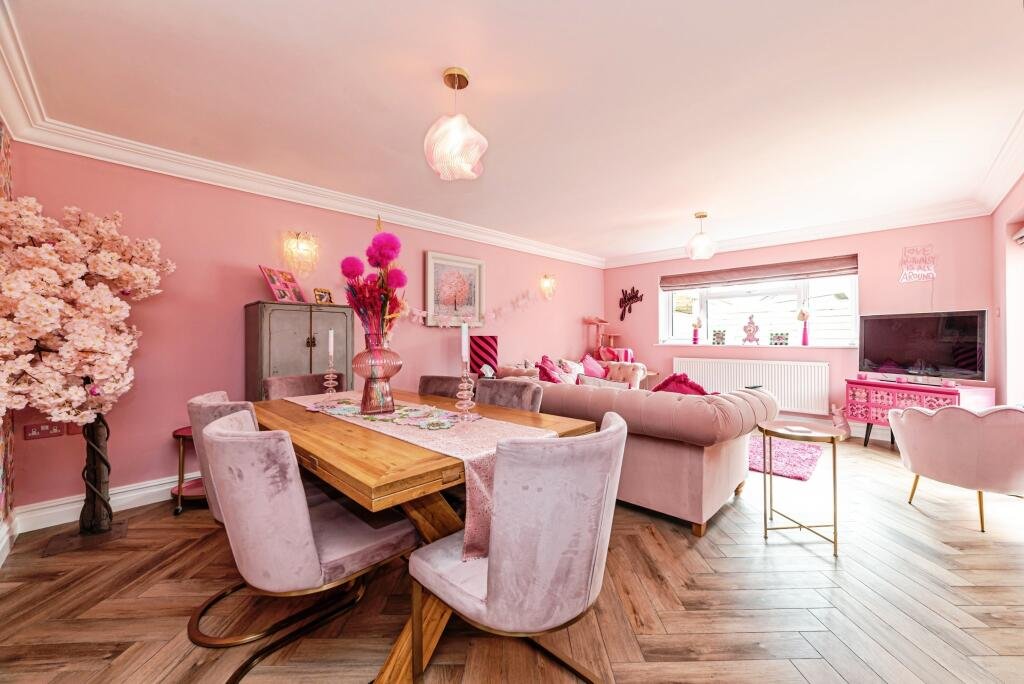 Britain's own Barbie Dream House is on sale for £725,000 - with a bubblegum kitchen, pink staircase, pink SMEG fridge and even a pink garage door.