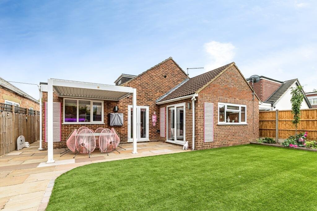 Britain's own Barbie Dream House is on sale for £725,000 - with a bubblegum kitchen, pink staircase, pink SMEG fridge and even a pink garage door.