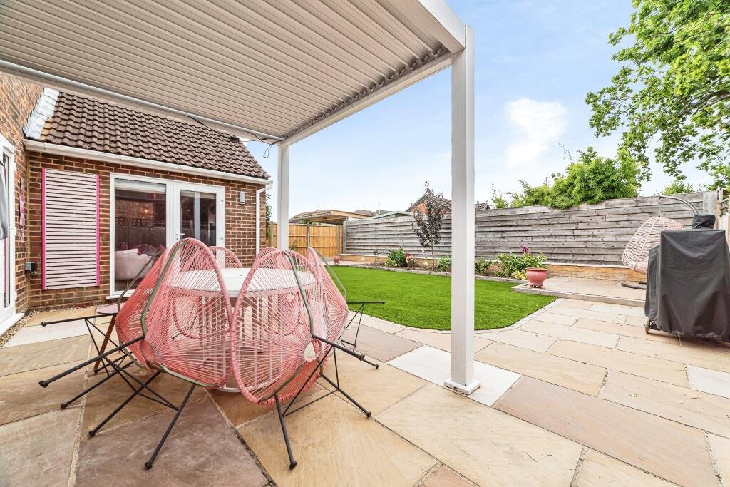 Britain's own Barbie Dream House is on sale for £725,000 - with a bubblegum kitchen, pink staircase, pink SMEG fridge and even a pink garage door.