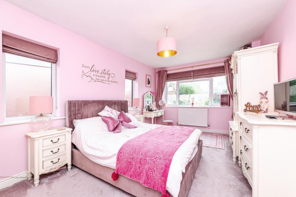 Britain's own Barbie Dream House is on sale for £725,000 - with a bubblegum kitchen, pink staircase, pink SMEG fridge and even a pink garage door.