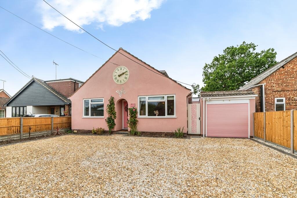 Britain's own Barbie Dream House is on sale for £725,000 - with a bubblegum kitchen, pink staircase, pink SMEG fridge and even a pink garage door.
