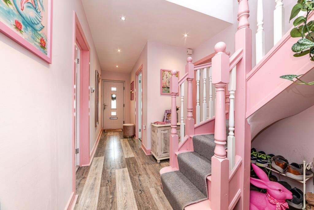 Britain's own Barbie Dream House is on sale for £725,000 - with a bubblegum kitchen, pink staircase, pink SMEG fridge and even a pink garage door.