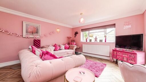 Britain's own Barbie Dream House is on sale for £725,000 - with a bubblegum kitchen, pink staircase, pink SMEG fridge and even a pink garage door.