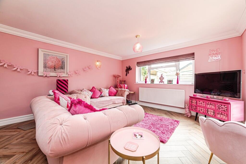 Britain's own Barbie Dream House is on sale for £725,000 - with a bubblegum kitchen, pink staircase, pink SMEG fridge and even a pink garage door.