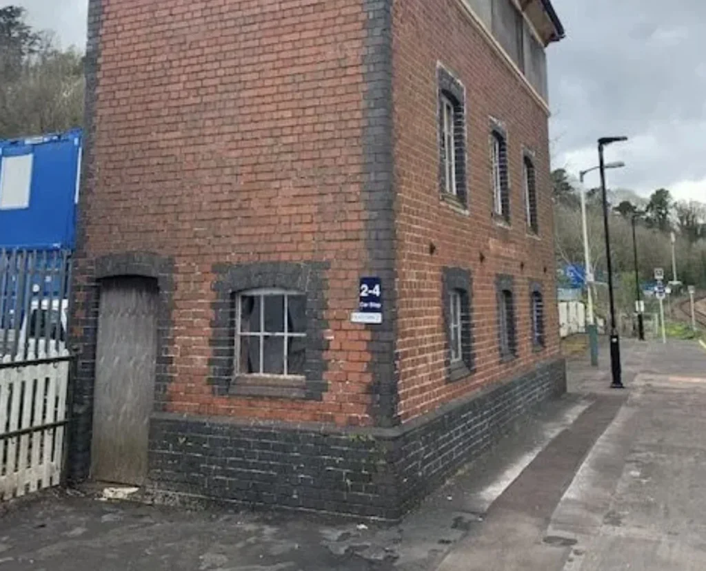 Britain's strangest holiday home - a Grade II-listed signal box on a working railway platform in Torquay, Devon - is on sale for just £29,000 at auction.