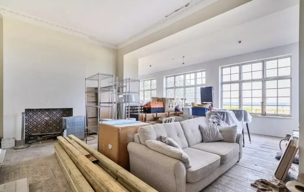 A sprawling 19-bed seaside manor with spectacular coastal views has hit the market for just £250,000 - but its new owner will have to tread unsafe areas if they want to.